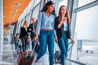 2 girls with suitcases